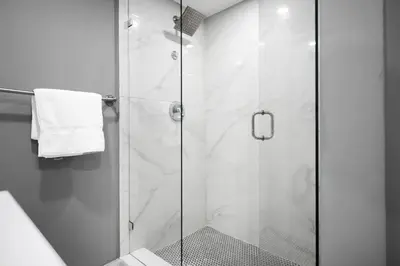a shower with a glass door in a bathroom at Beachfront Luxury Alexander Unit, Pool Gym Parking in Miami Beach