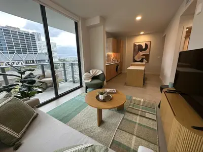 a living room with a view of a building at Sophisticated 2BR2BA at Miami World Center in Miami