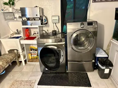 a washing machine and a washer in a kitchen at Exclusive suites in Fort Lauderdale