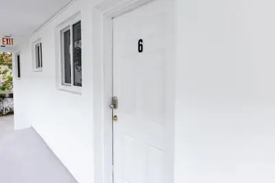 a white door with the number on it at Riverside Retreat Skyline Views & Beach Nearby in Miami