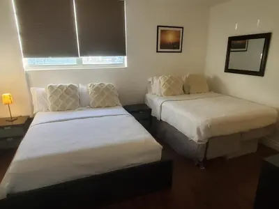 a hotel room with two beds and a window at Hollywood Beach, Miami, Oceanfront retreat in Hollywood