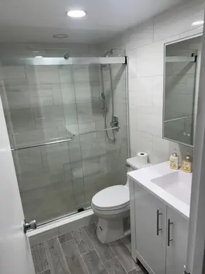 a bathroom with a shower and a toilet and a sink at Hollywood Beach, Miami, Oceanfront retreat in Hollywood