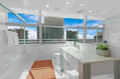 a white bathroom with a view of the city at Luxury Brickell 3BD Free Parking - Pool - Bay View in Miami