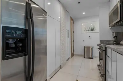 a kitchen with a stainless steel refrigerator at Luxury Brickell 3BD Free Parking - Pool - Bay View in Miami