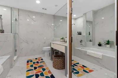 a bathroom with a tub and a sink and a toilet at Luxury Brickell 3BD Free Parking - Pool - Bay View in Miami