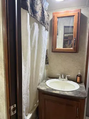 a bathroom with a sink and a mirror at Getsemany Inc RV Dreams Hollywood in Hollywood