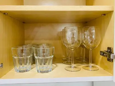 a row of wine glasses sitting on a shelf at West Brickell #2 Renovated 2 2 Apt + Parking in Miami