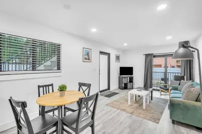 a living room with a table and a couch at West Brickell #2 Renovated 2 2 Apt + Parking in Miami