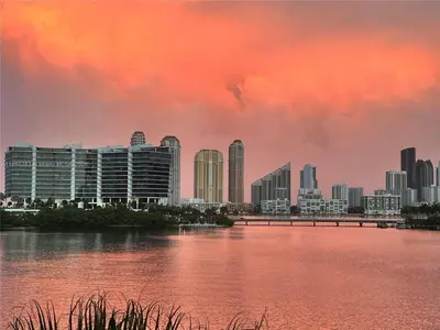 a view of a city with a river and buildings at Serene Waterfront Condo - Bayview, pool & tennis in Aventura