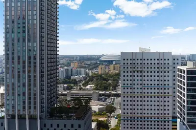 a view of a city with two tall buildings at Downtown Drift-Luxury Amenities Sauna & Pool in Miami