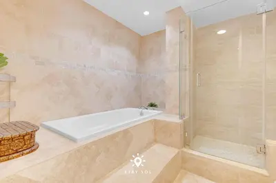 a bathroom with a bath tub and a shower at Luxury by the Sea- 2BR Pool & Gym -Hollywood in Hollywood