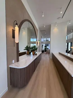 a lobby with a reception counter with a large mirror at Downtown Miami 1BR Walk to Bayside Kaseya Gym Pool in Miami