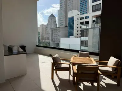 a dining room with a table and chairs and a large window at Downtown Miami 1BR Walk to Bayside Kaseya Gym Pool in Miami