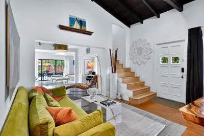 a living room with a couch and a staircase at Villa 800 - 3 BEDROOM - 3 AND A HALF BATHROOMS -6 BEDS- Spa like Retreat Saline Pool & Jacuzzi in Miami