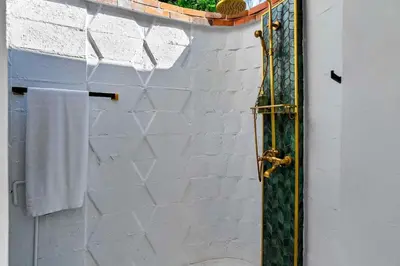 a bathroom with a shower with a toilet and a mirror at Villa 800 - 3 BEDROOM - 3 AND A HALF BATHROOMS -6 BEDS- Spa like Retreat Saline Pool & Jacuzzi in Miami