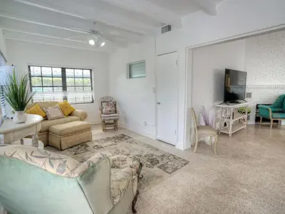 a living room with a couch and a table at Holiday Home Guest House at the Ocean by Interhome in Fort Lauderdale