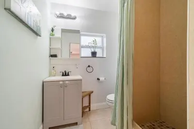a bathroom with a sink and a toilet and a shower at Shady Banks Oasis in Fort Lauderdale