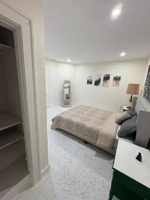 a bedroom with a bed and a couch at Villa Habana in Miami