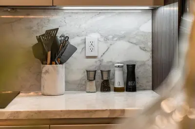 a counter with bottles and utensils on it at Casa Monstera Heated Saltwater Pool Game Room Golf in Fort Lauderdale