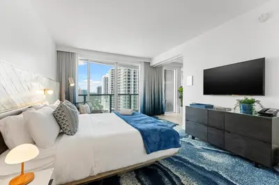 a bedroom with a large bed and a large window at W Fort Lauderdale Corner Unit with Ocean View and Resort Access - 2BR 2BA in Fort Lauderdale