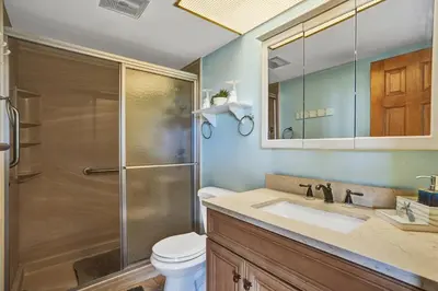 a bathroom with a shower and a sink and a toilet at Fort Lauderdale Waterfront Condo! Pool and Marina Views in Fort Lauderdale