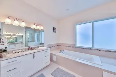 a white bathroom with a tub and a large window at Supremacy Villa STR-6110 in Davie