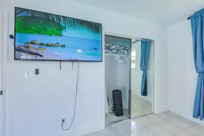 a flat screen tv on a wall in a room at Eat Pray Love Villa in Hollywood