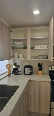 a kitchen with a sink and a counter top at Sunrise Oasis in Sunrise