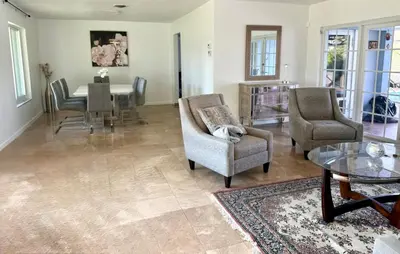 a living room with chairs and a table and a dining room at House across from Baptist Hospital in Sunset Corners