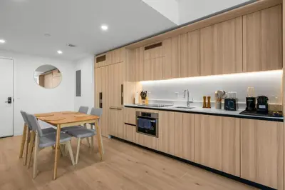a kitchen and dining room with a table and chairs at Modern Downtown Miami Condo w Pool and Gym in Miami