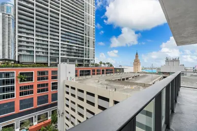 a view of a city from the balcony of a building at Premium High-Rise Living at 501 First - Downtown Miami in Miami