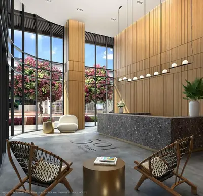 a lobby with two chairs and a reception desk at Premium High-Rise Living at 501 First - Downtown Miami in Miami