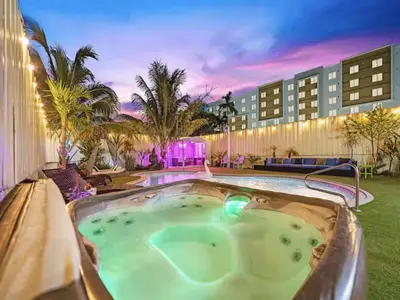 a hot tub in the middle of a resort at The Gilded Palm - Near Design District - Pool & Hot Tub in Miami