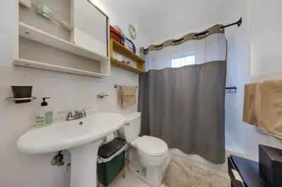 a bathroom with a sink and a toilet and a shower at Serene Cottage Retreat Ideal for Couples & Solo Travelers in Miami