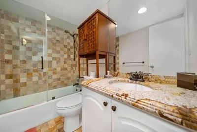 a bathroom with a sink and a toilet and a tub at C16P Oceanfront Penthouse in Hollywood FL in Hollywood
