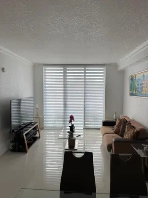 a living room with a couch and a tv at C16P Oceanfront Penthouse in Hollywood FL in Hollywood