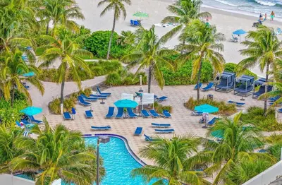 an aerial view of the pool and beach at the resort at C16P Oceanfront Penthouse in Hollywood FL in Hollywood