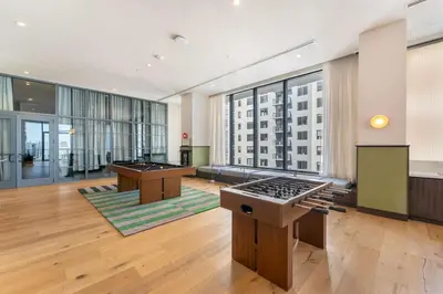 a large room with two billiard tables in a building at Crosby Miami WTC Studio Sleek #2506 in Miami