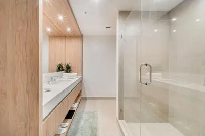a bathroom with a glass shower and a sink at Crosby Miami WTC 1BR 1BA Central Stay #1405 in Miami