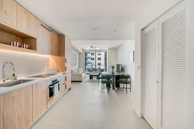 a kitchen with a sink and a table with chairs at Crosby Miami WTC 1BR 1BA Central Stay #1405 in Miami