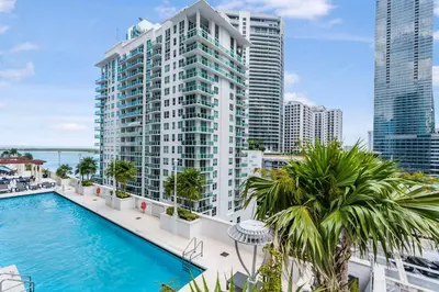 an image of a large building with a swimming pool at Brickell Stay with City Views in Miami