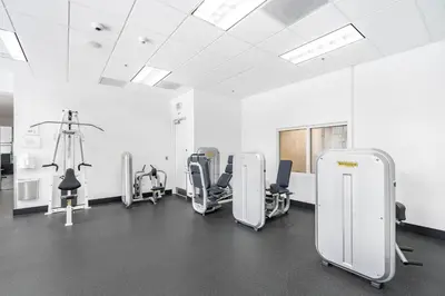an empty room with chairs and a gym at Brickell Stay with City Views in Miami