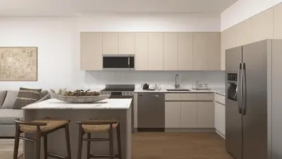 a kitchen with white cabinets and a bowl of fruit on a counter at Sleeps 18 3 Suites in New Luxury Hotel w Rooftop Pool Sense28 by AvantStay in Miami