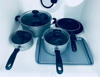 three pots and spoons sitting on a tray at The Luxe Studio in Miami Gardens