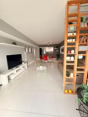 a living room with a large white tile floor at Modern 2BR beachfront with pool & tennis view in Sunny Isles Beach