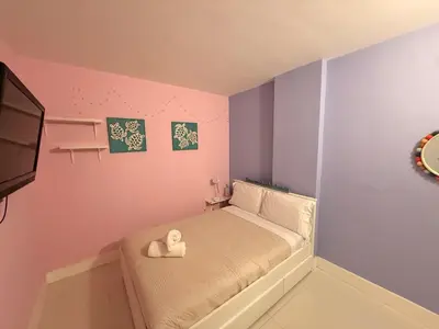 a small bedroom with a bed with a toy on it at Modern 2BR beachfront with pool & tennis view in Sunny Isles Beach