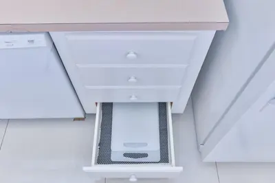 a white kitchen cabinet with a drawer at The Elevated Above STR-02687 in Sunny Isles Beach