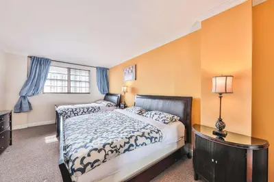 a bedroom with two beds and a window at Ocean view Penthouse - Royal stay in Sunny Isles Beach