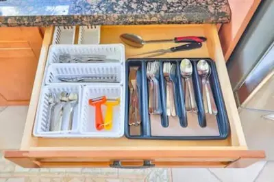 a drawer full of utensils in a counter top at LUX View Villa in Fort Lauderdale