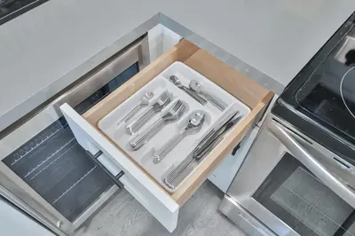 a drawer in a kitchen with silver utensils at Miami Cruise Family House in Fort Lauderdale